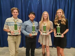 4-H youth winning trophies at National 4-H Poultry & Egg Conference